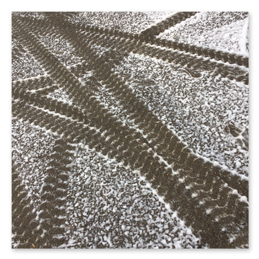Snow - tyre tracks in settled foam snow